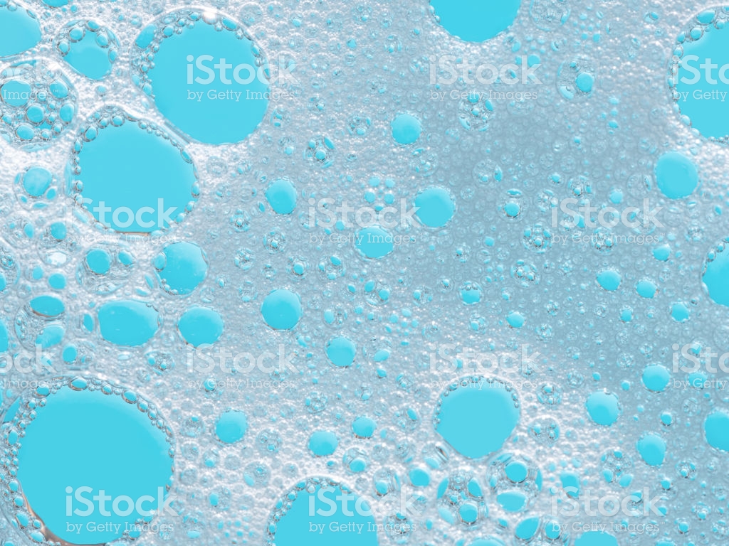 Turquoise Froth Foamy Background Soap Detergent Bubbles On Water