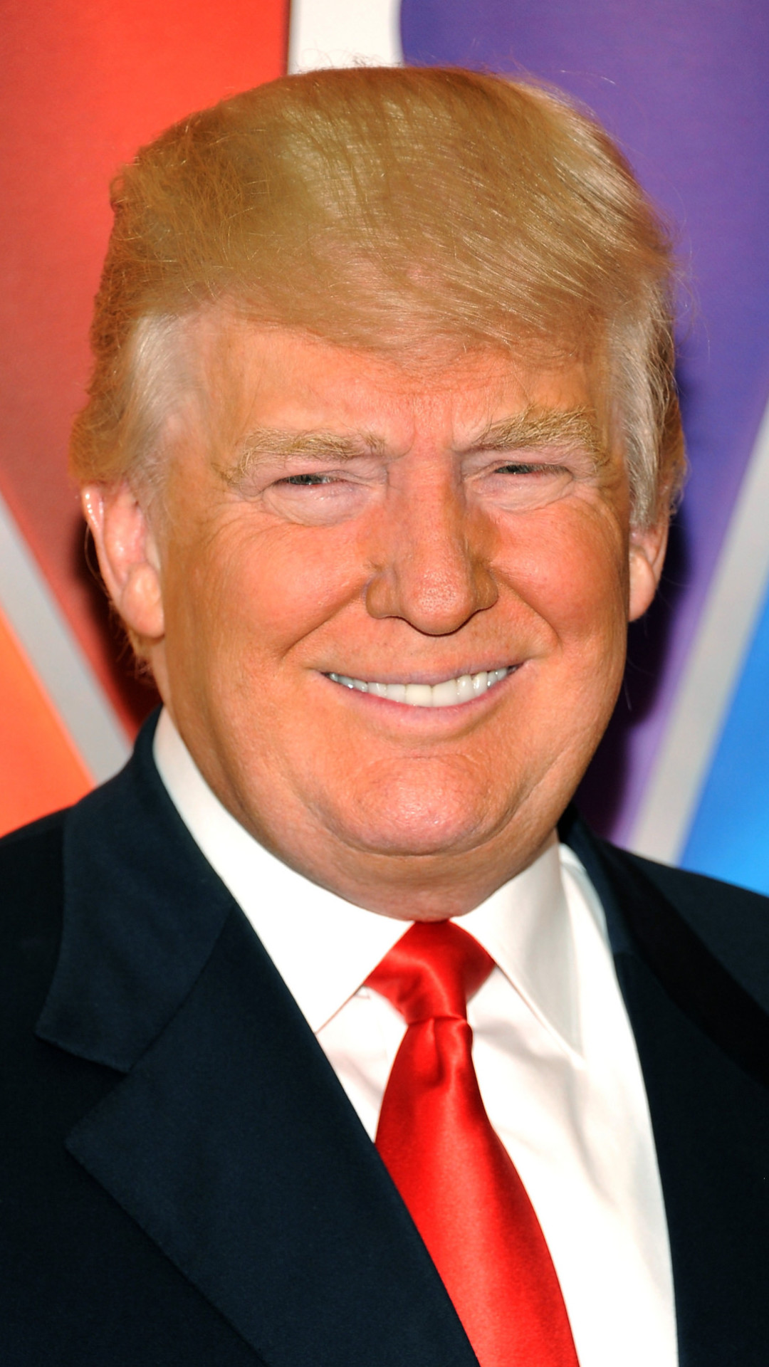 Donald Trump, a prominent figure in the Republican Party, smiles for a portrait