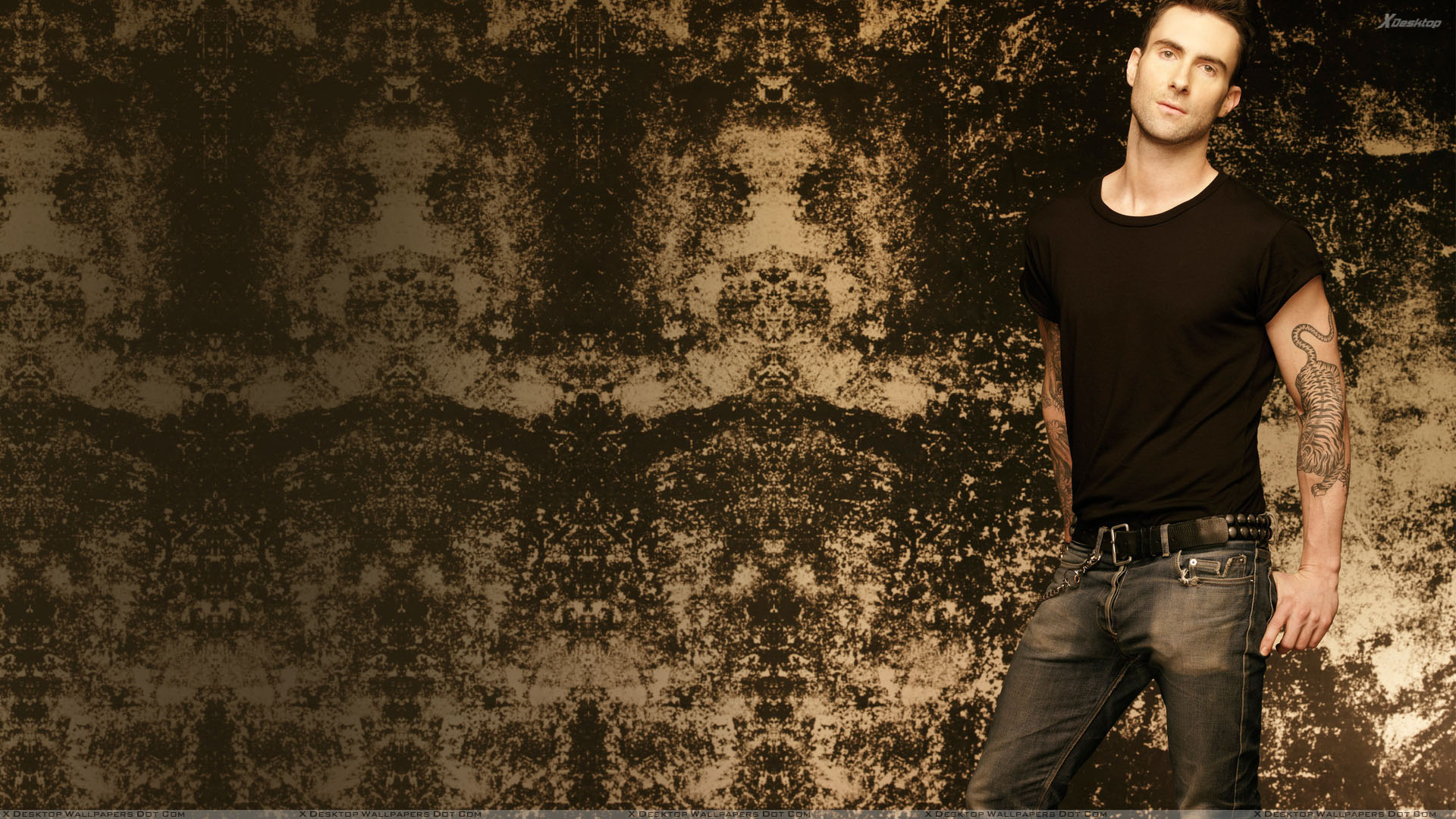 Adam Levine In Black T Shirt And Tatoo On Arm Wallpaper