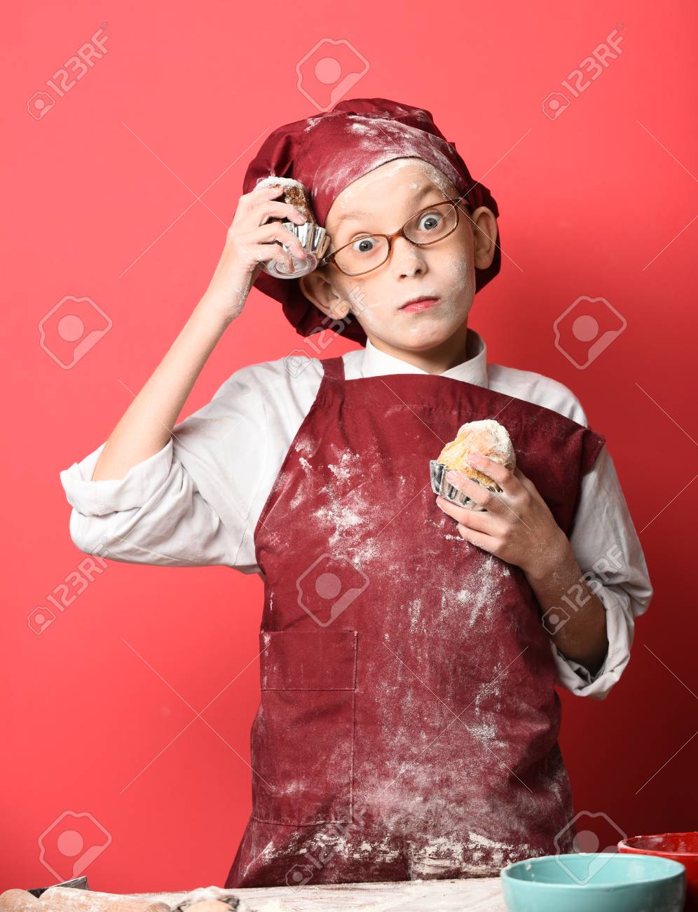 Young Boy Cute Cook Chef In Uniform And Hat On Stained Face Flour