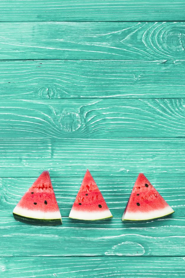 Premium Photo Red Pieces Of Fresh Watermelon On Green Background