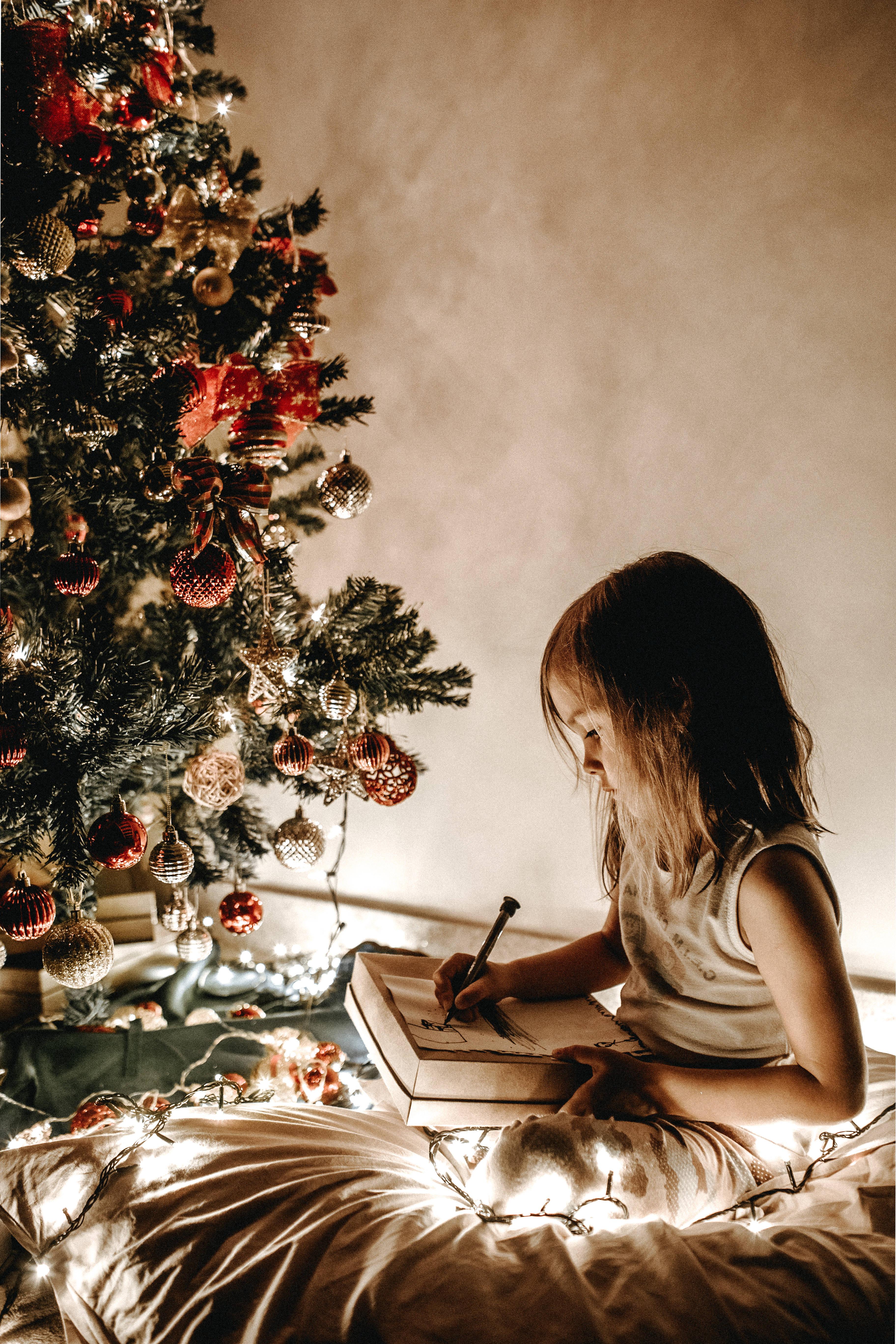 An Adorable Little Girl Sits In The Middle Of A Festive