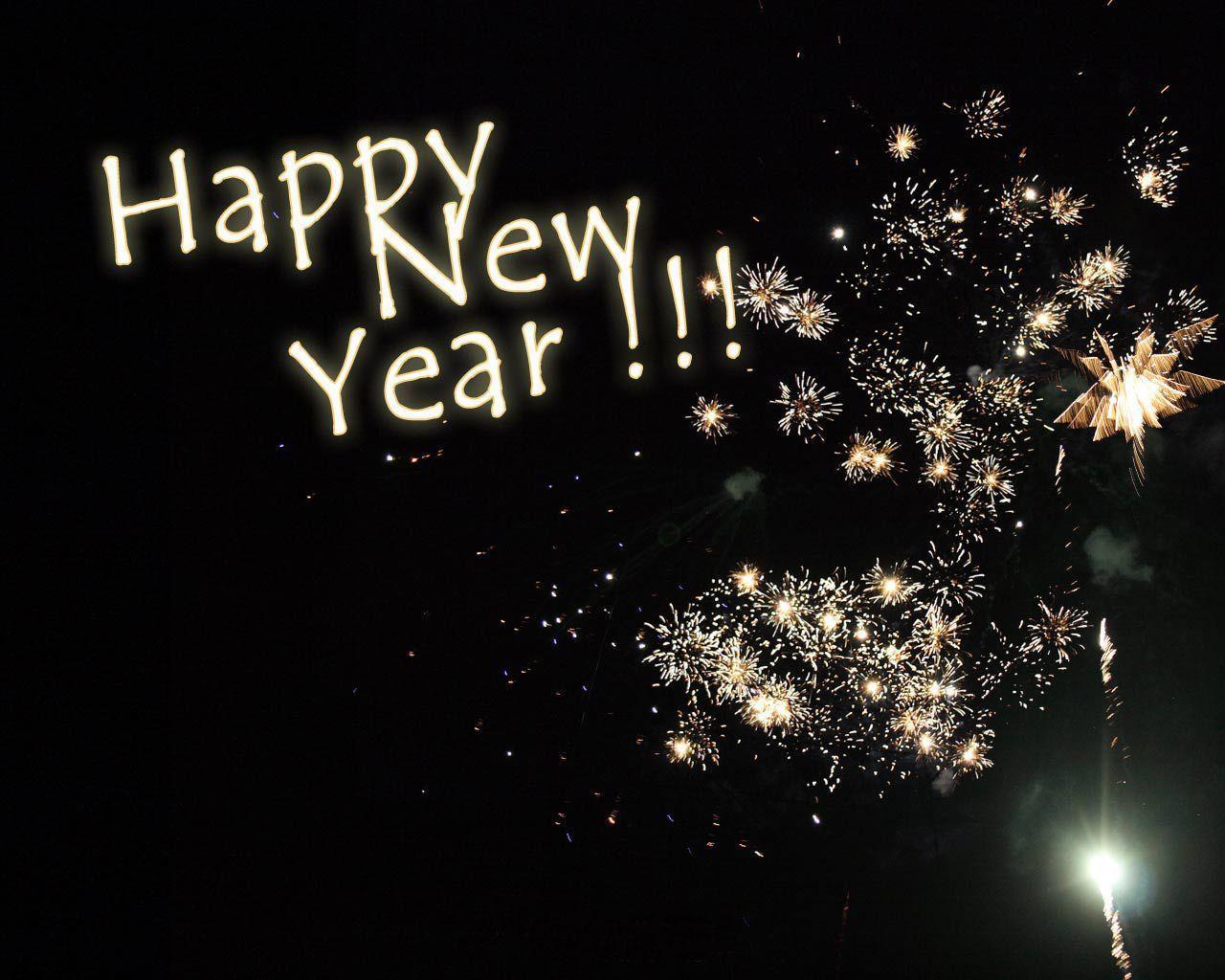 Fireworks exploding against a dark night sky with the text 'Happy New Year!!' overlaid in white