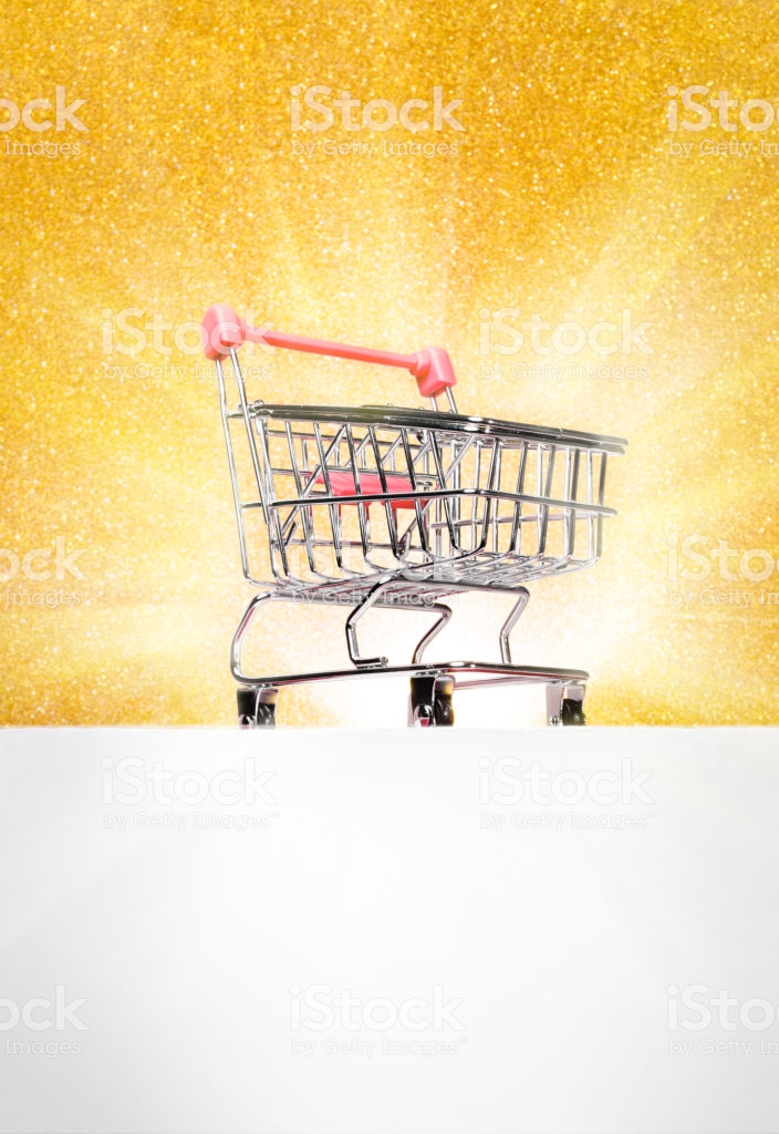 Trolley For Shopping On A Pedestal Gold Background With