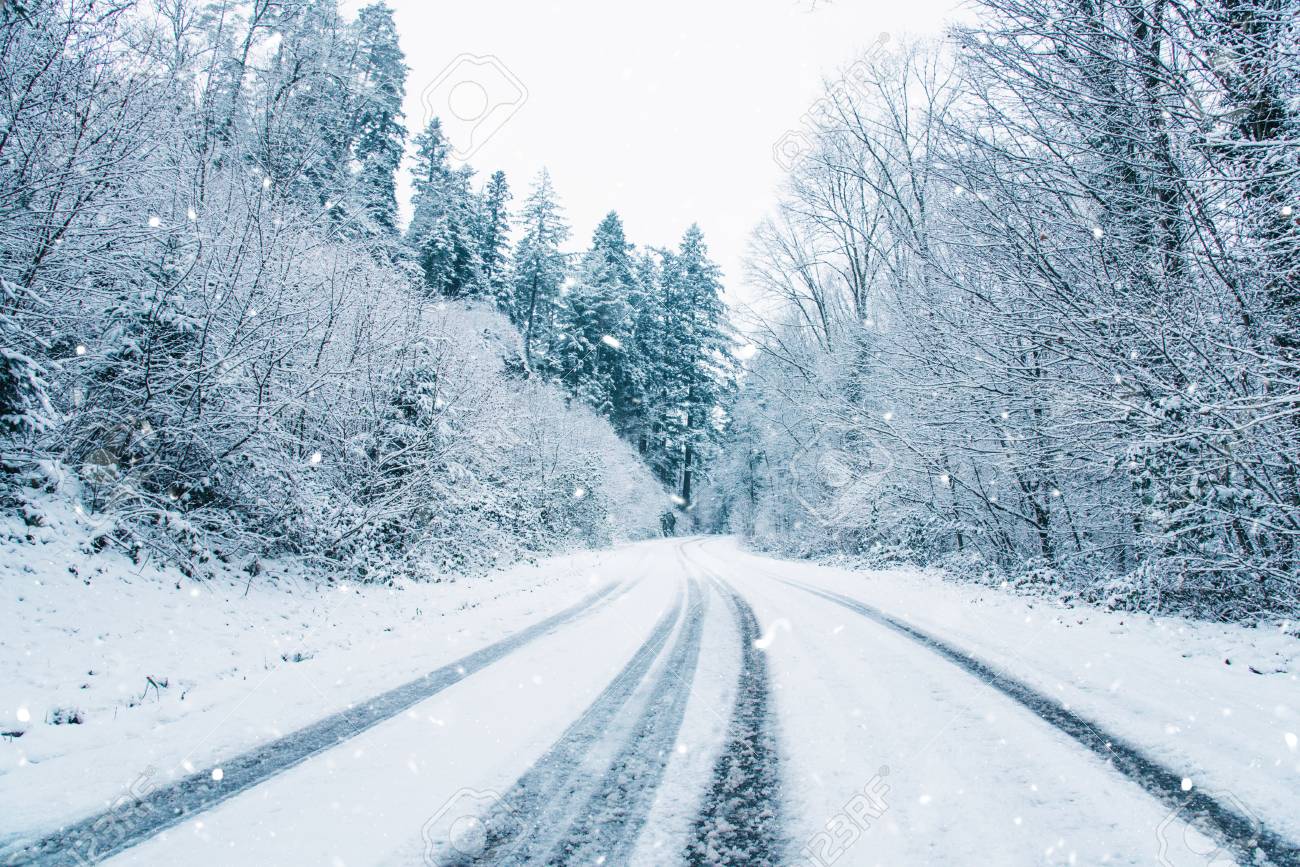 Snow Covered Road In The Winter Forest Black Germany