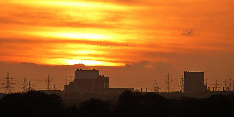 Sunset over 1980s built nuclear plants in Heysham UK that have been