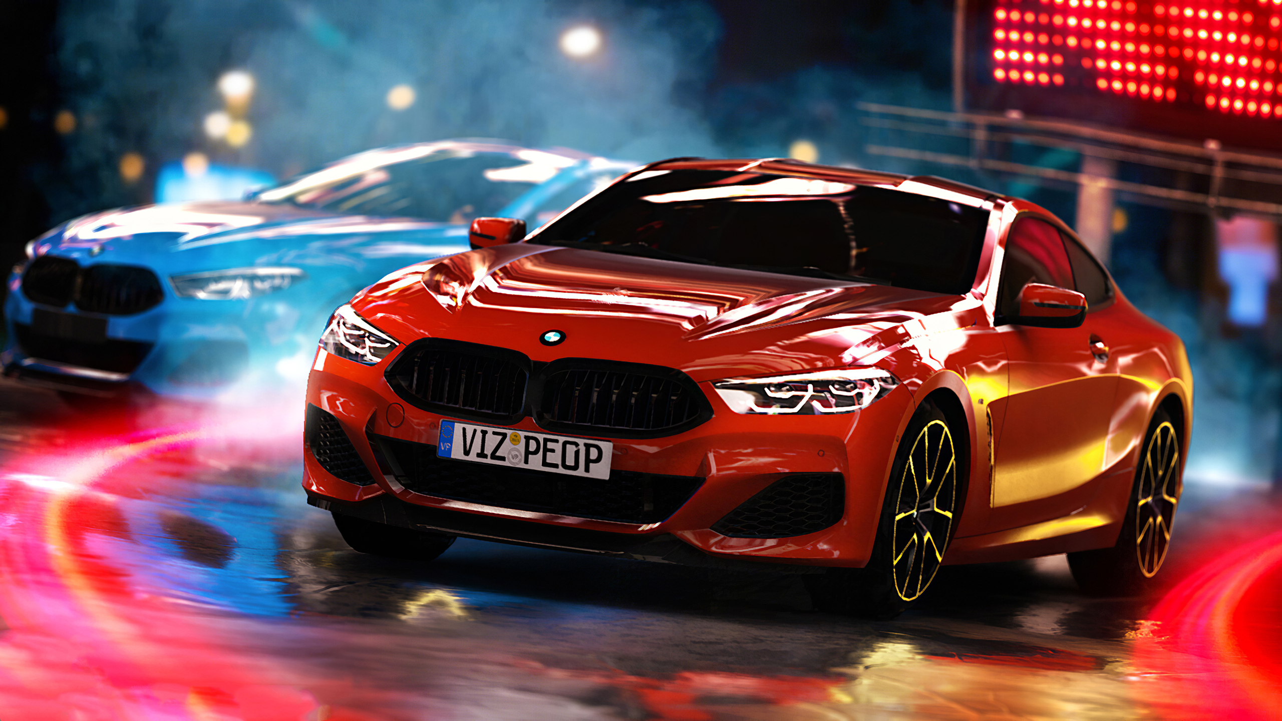 Red BMW 8 Series Coupe in motion, with a blurred blue BMW in the background