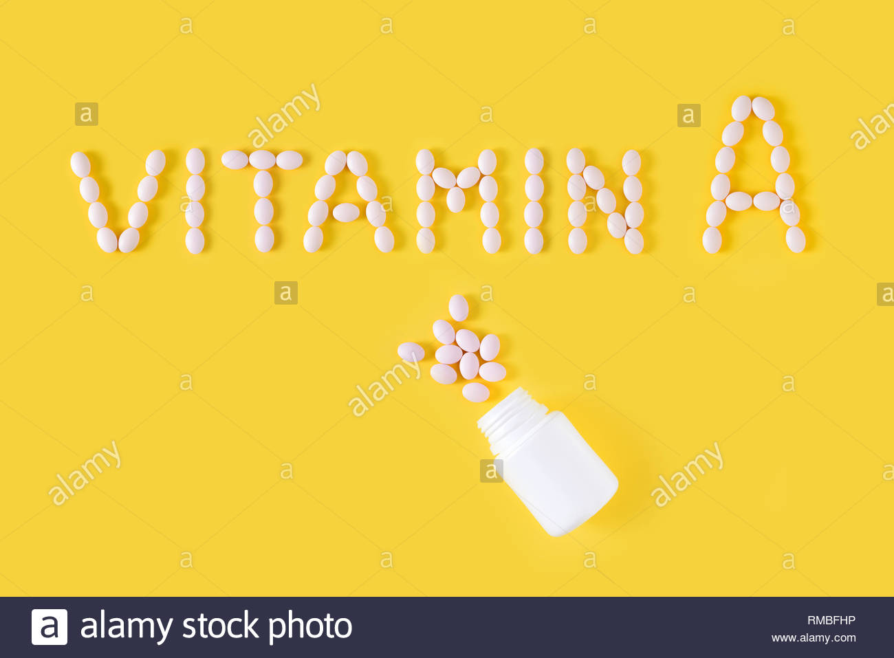 Vitamin A Pills Dropped From Bottle On Yellow Background Flat Lay