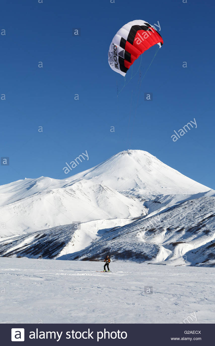Kiteboarding Or Snowkiting Sportsman Glides On Skis Snow A