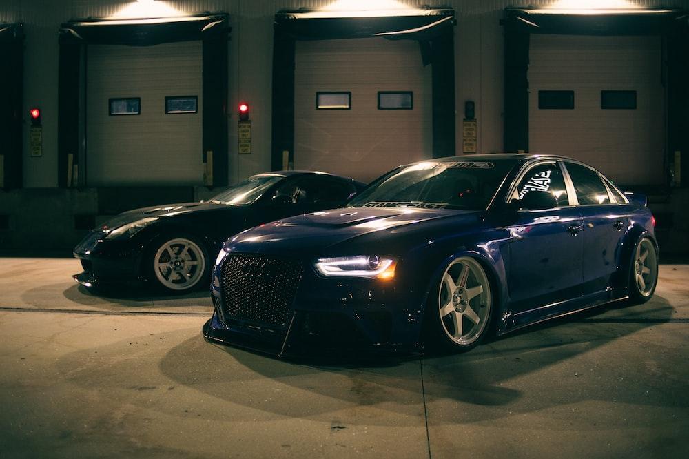 two cars parked in a garage photo Free Car Image on