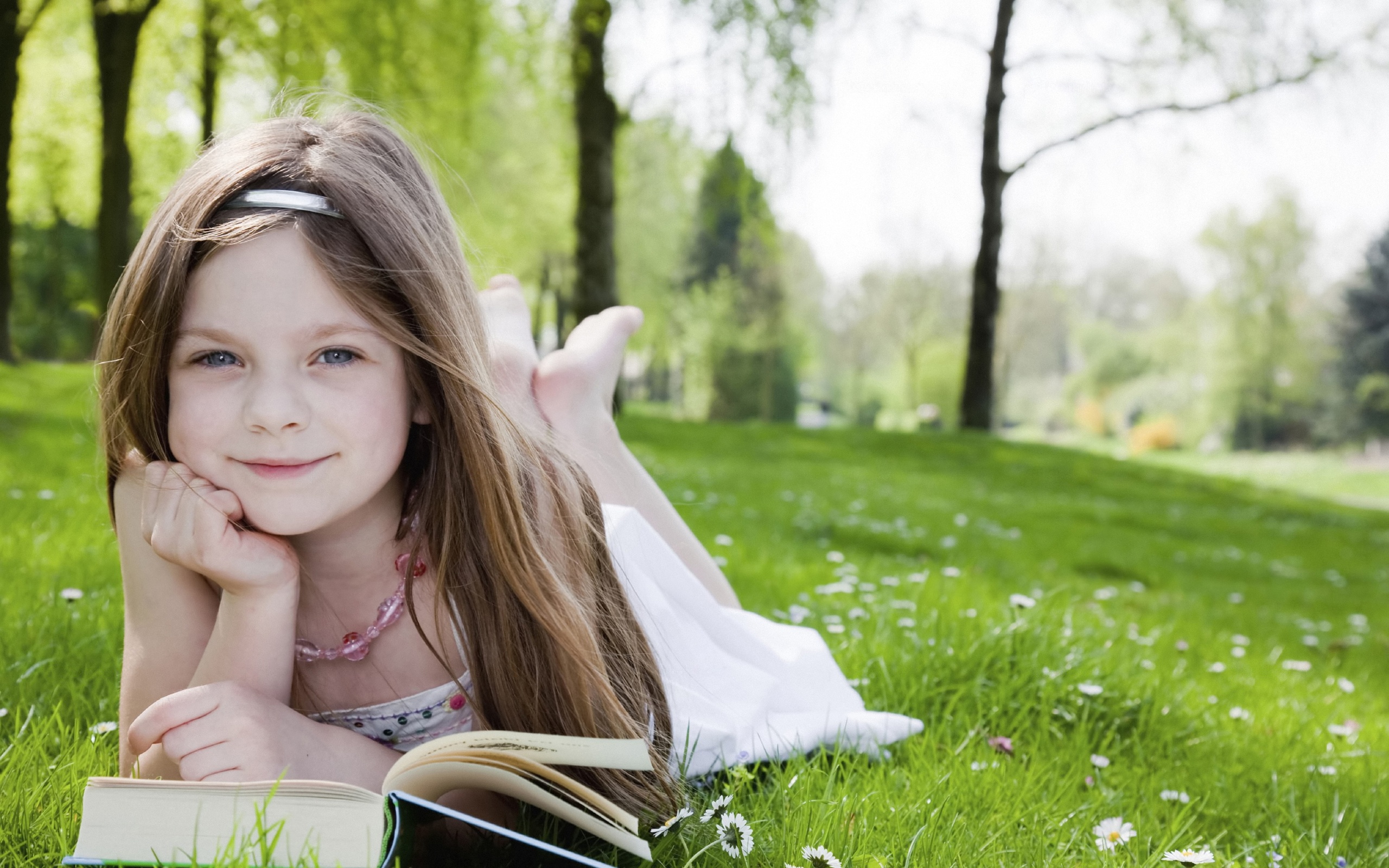 Little Girl Reading A Book Wallpaper