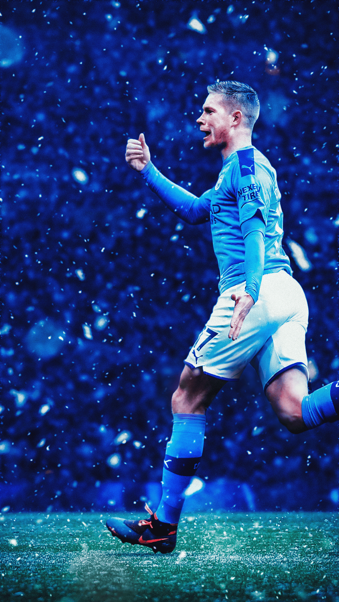 Kevin De Bruyne of Manchester City celebrates a goal in a snowy match