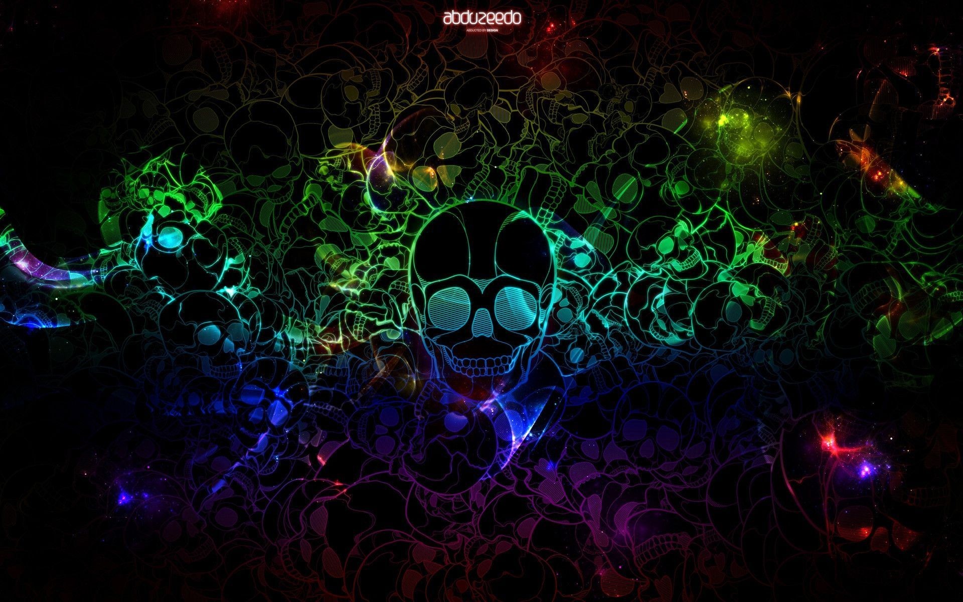 A cool wallpaper for PC featuring neon-colored skulls on a black background