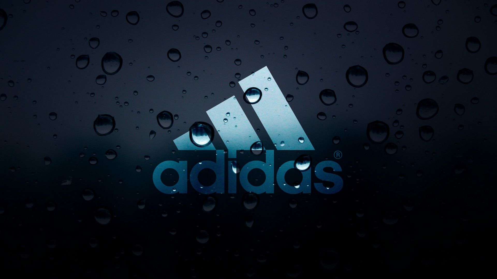 Adidas Logo on Rainy Window: A stylish wallpaper featuring the iconic Adidas logo against a backdrop of rain-covered glass