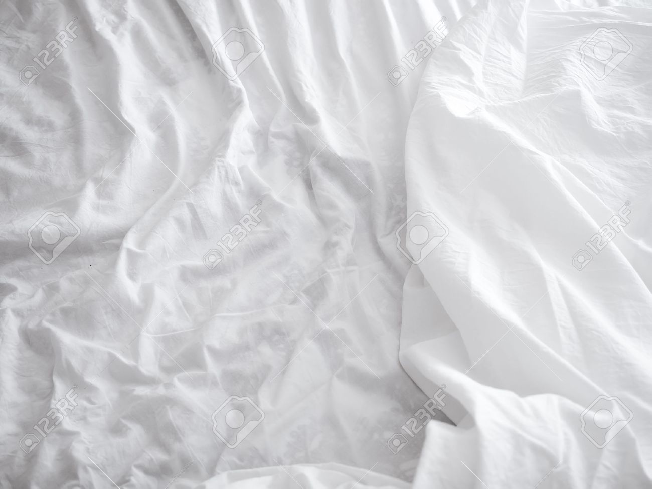 White Bed Sheets Background Stock Photo Picture And Royalty