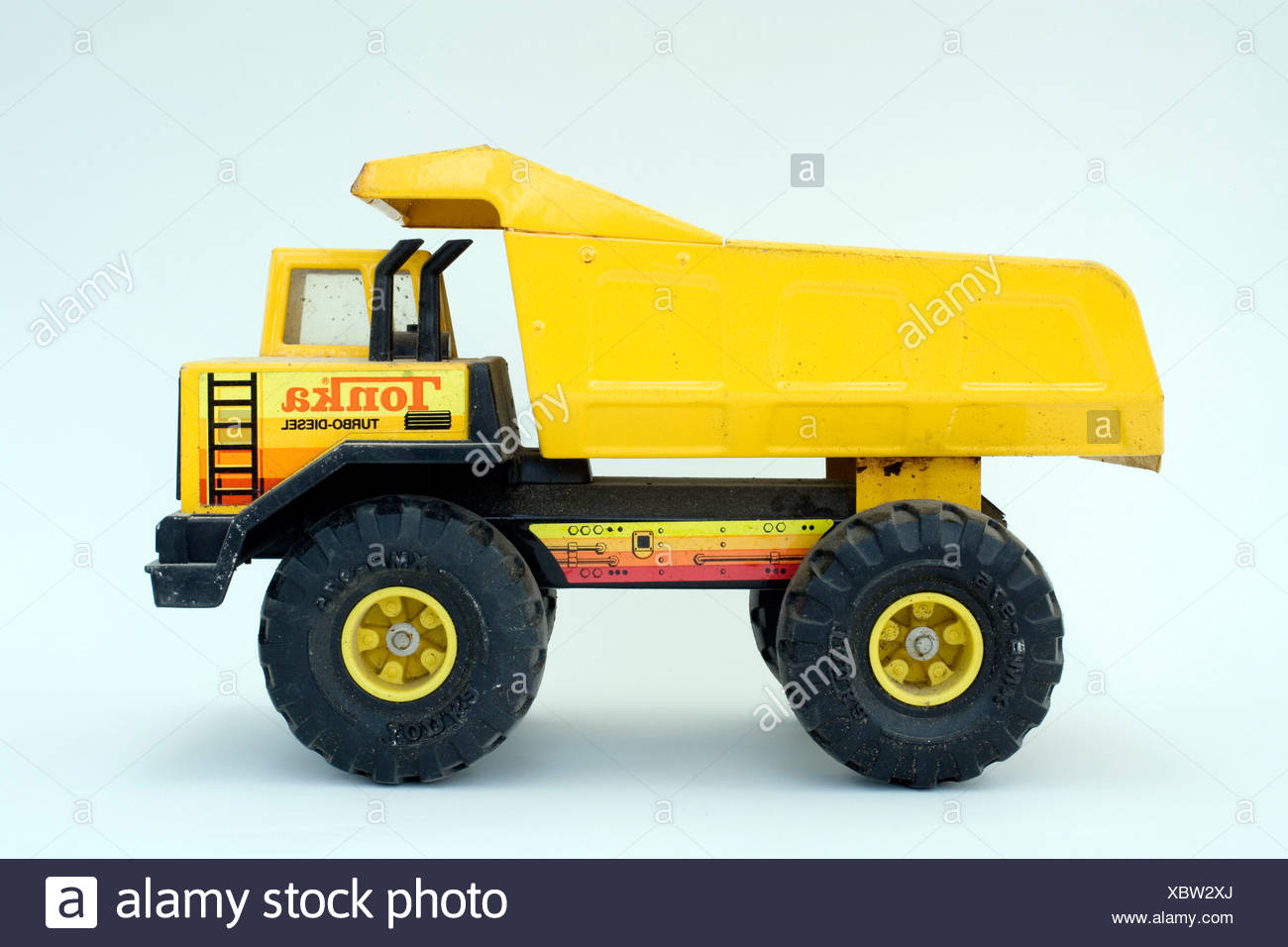 Yellow Tonka Toy Truck On A White Background Stock Photo