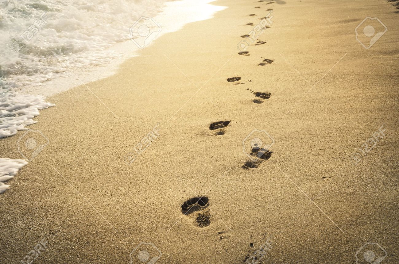Footprints In The Sand At Sunset Stock Photo Picture And Royalty