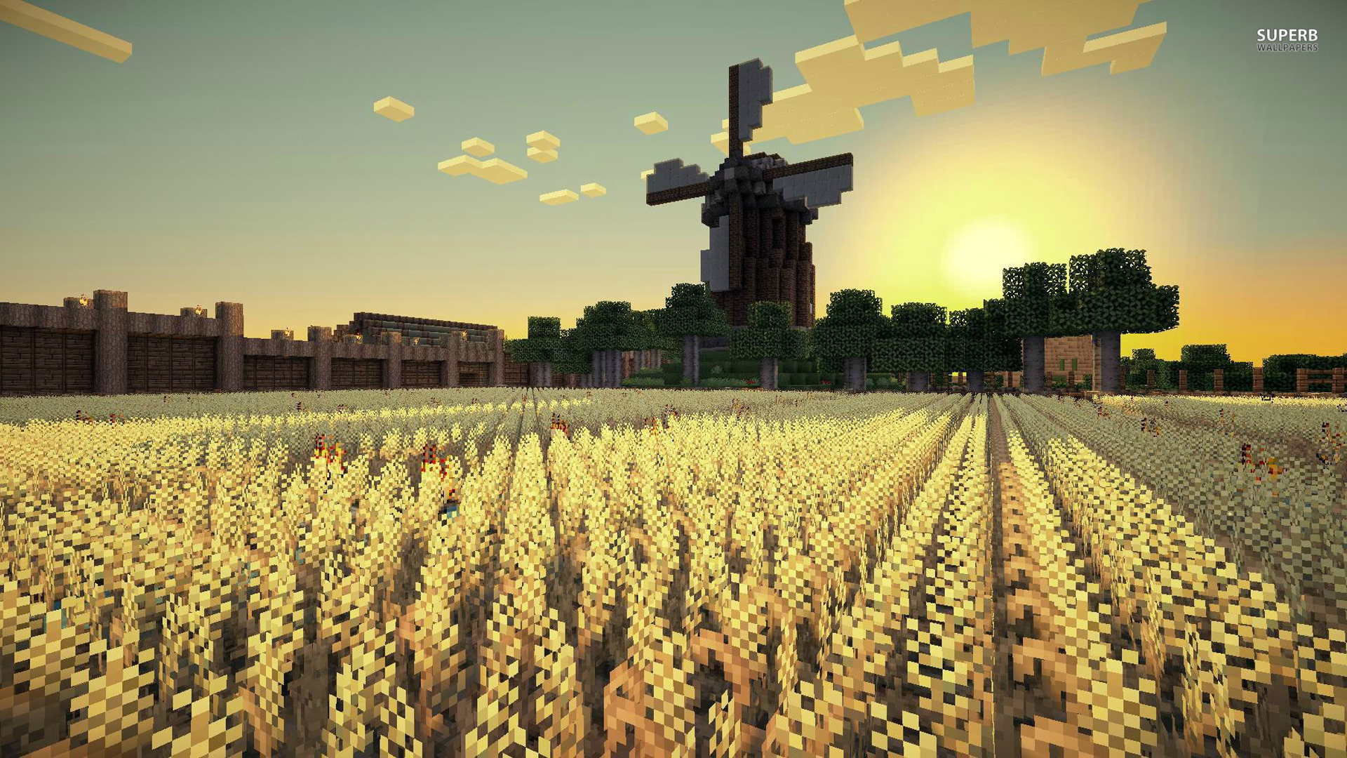 A picturesque Minecraft landscape at sunset with a windmill, wheat field, and wooden fence