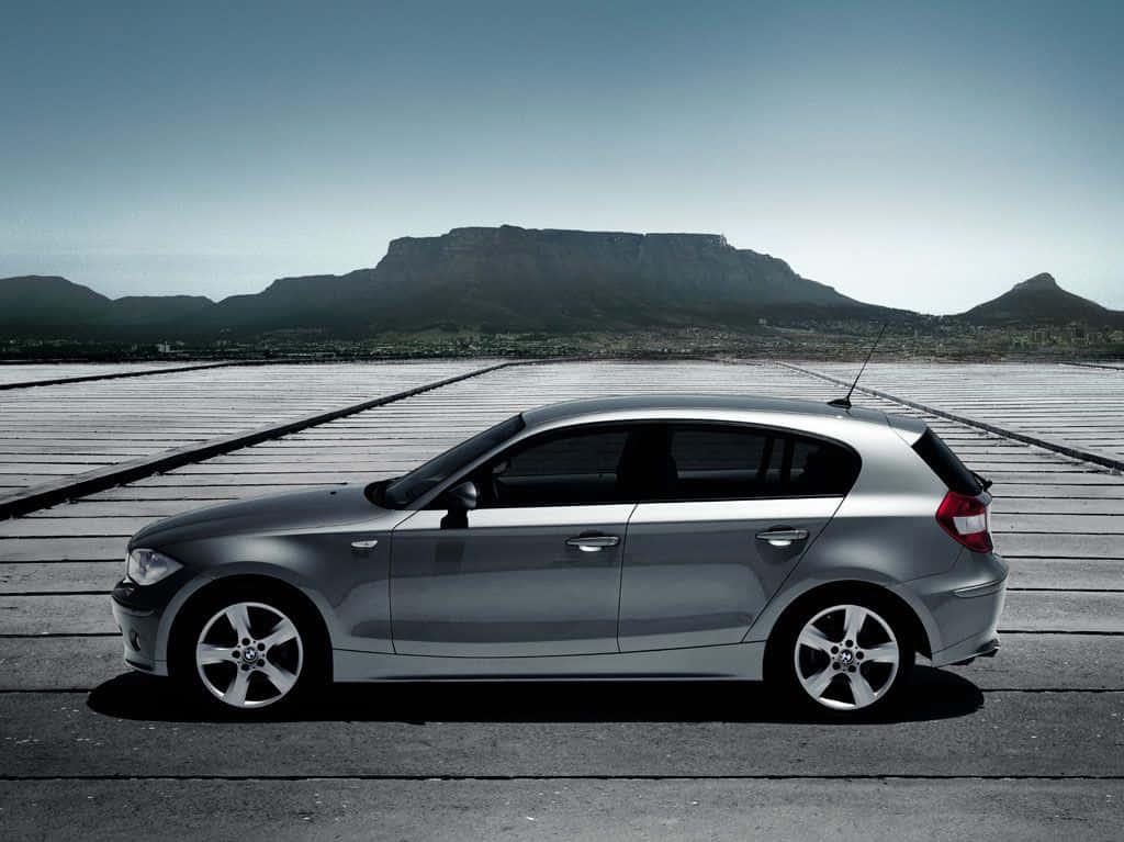 Sleek And Modern Bmw Series On Road Wallpaper