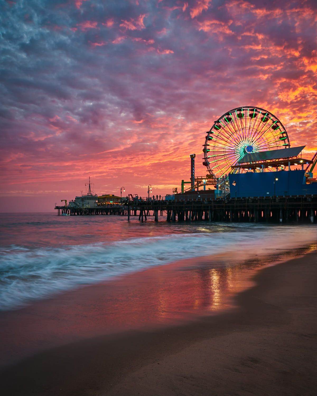 A Fiery Sunset Over Santa Monica Pier By Wojciech Szela Wallpaper