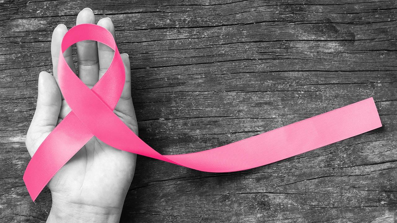 Hand Holding Ribbon Breast Cancer Awareness Wallpaper