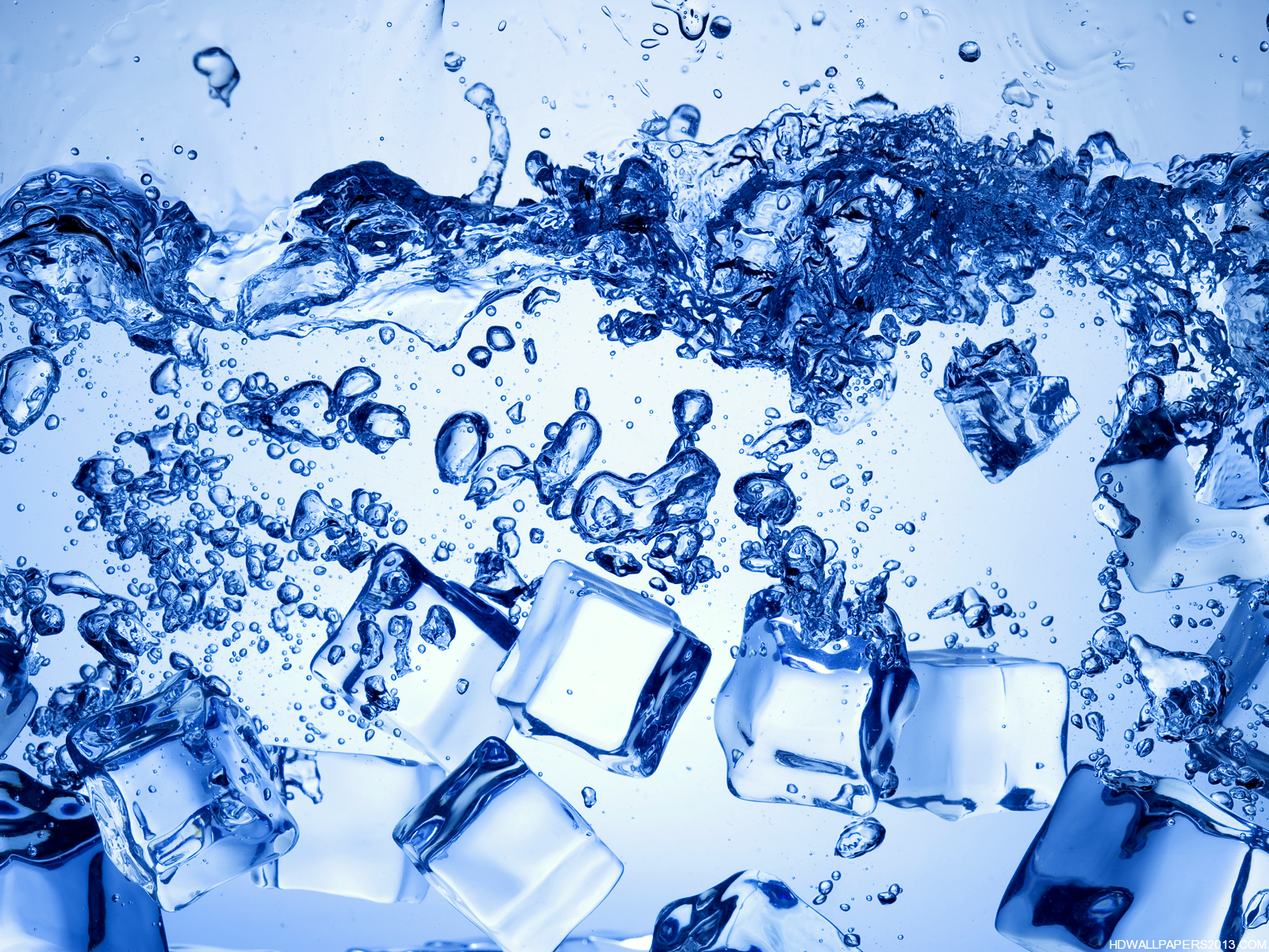 Ice cubes submerged in sparkling water, creating a refreshing and cool visual