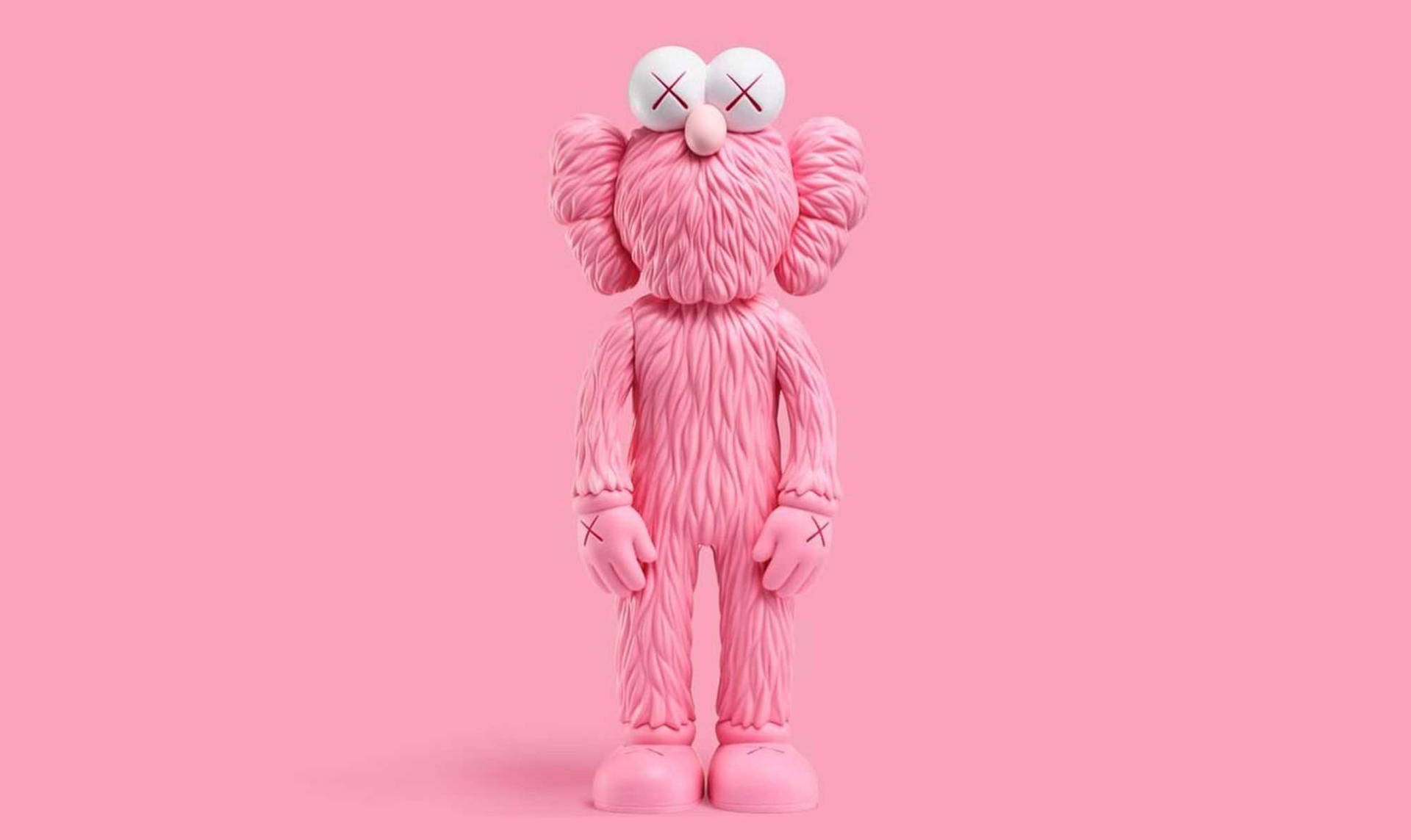 Pink KAWS Companion figure against a pink background