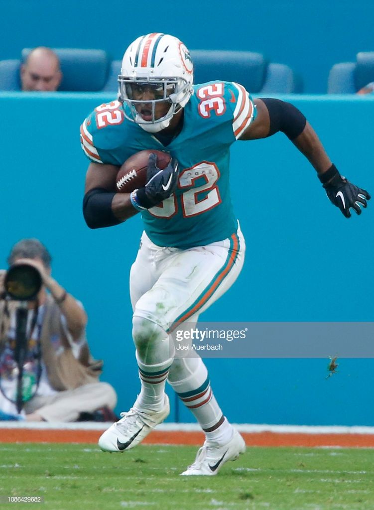 Kenyan Drake Of The Miami Dolphins Runs With Ball Against