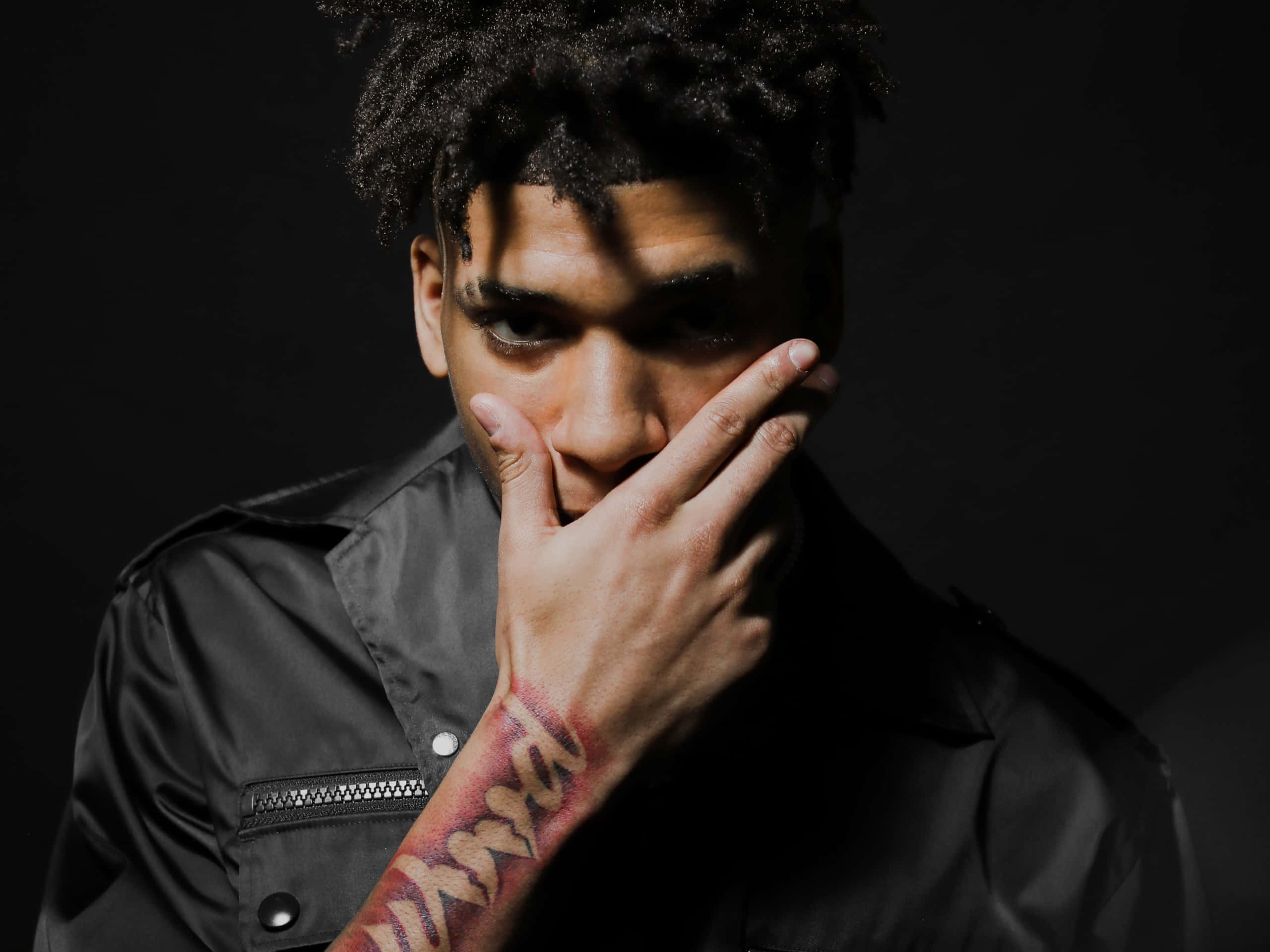 Rising Star Nle Choppa In Action Wallpaper