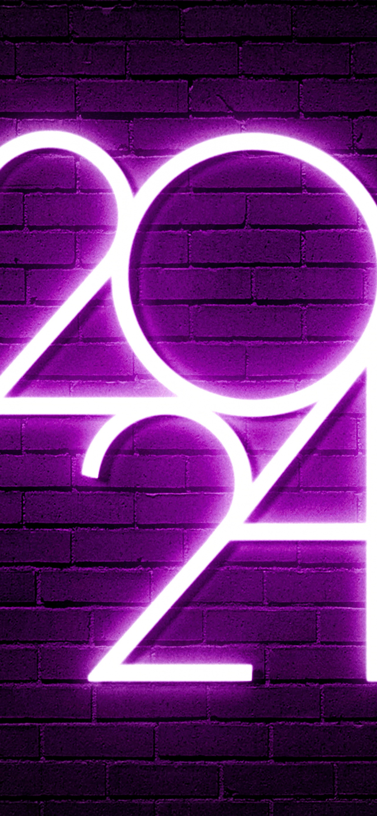 A vibrant purple neon sign displaying '2024' against a dark brick wall, perfect for an aesthetic 2024 wallpaper