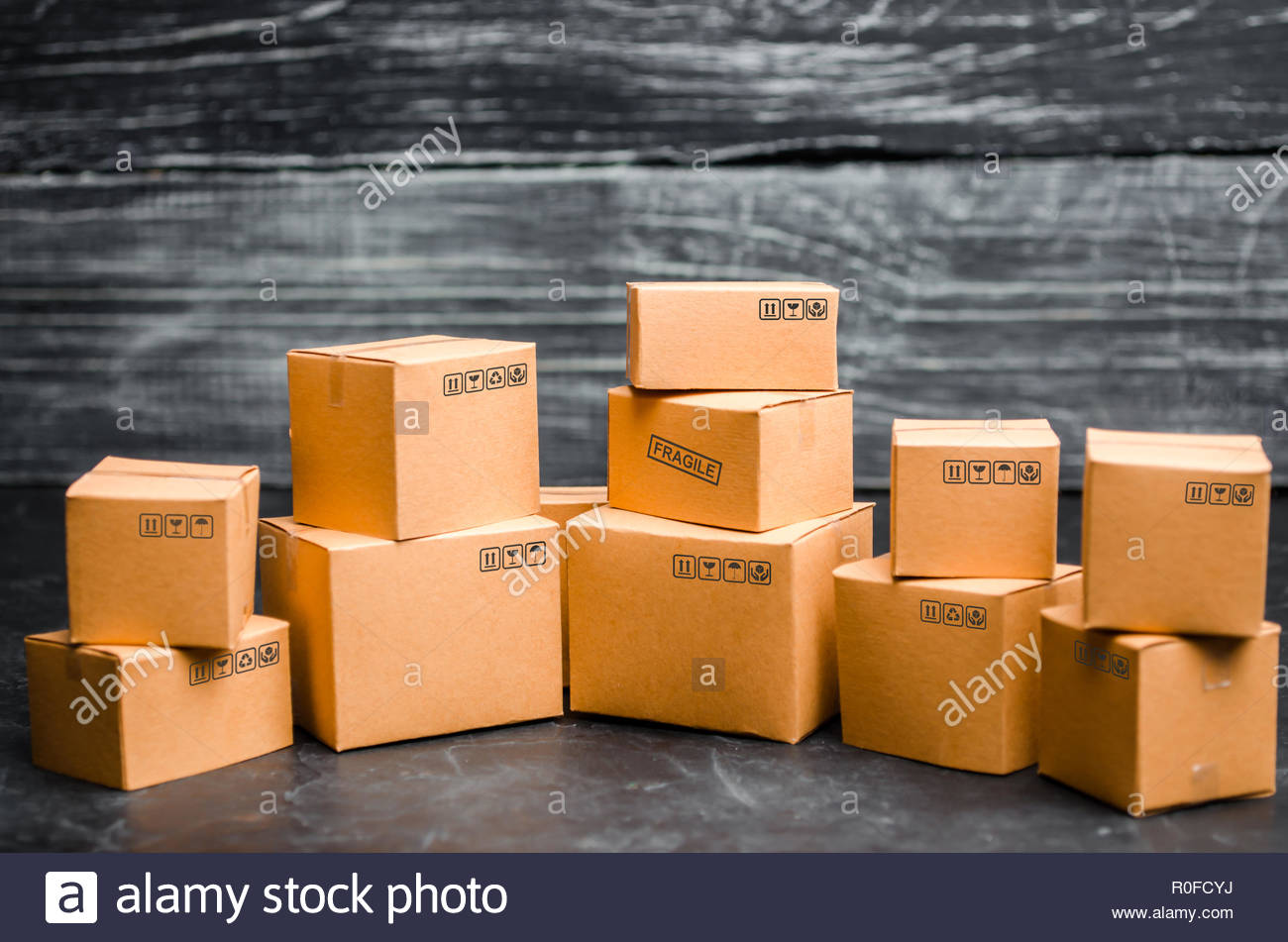 Cardboard Boxes On A Dark Background The Concept Of Packing Goods