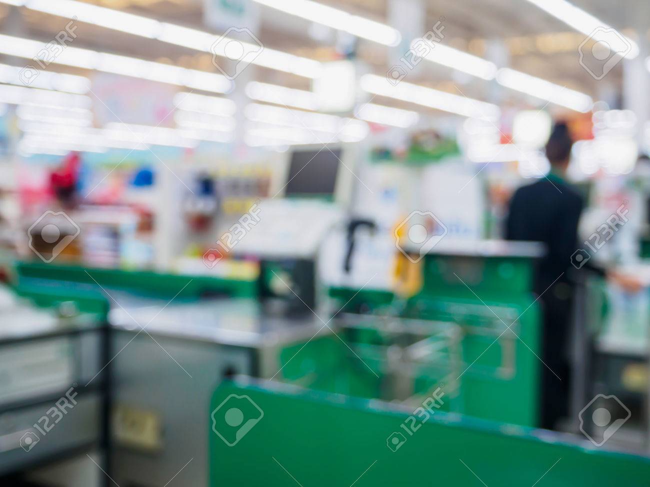 Supermarket Checkout Cashier Counter In Store Blurred Background