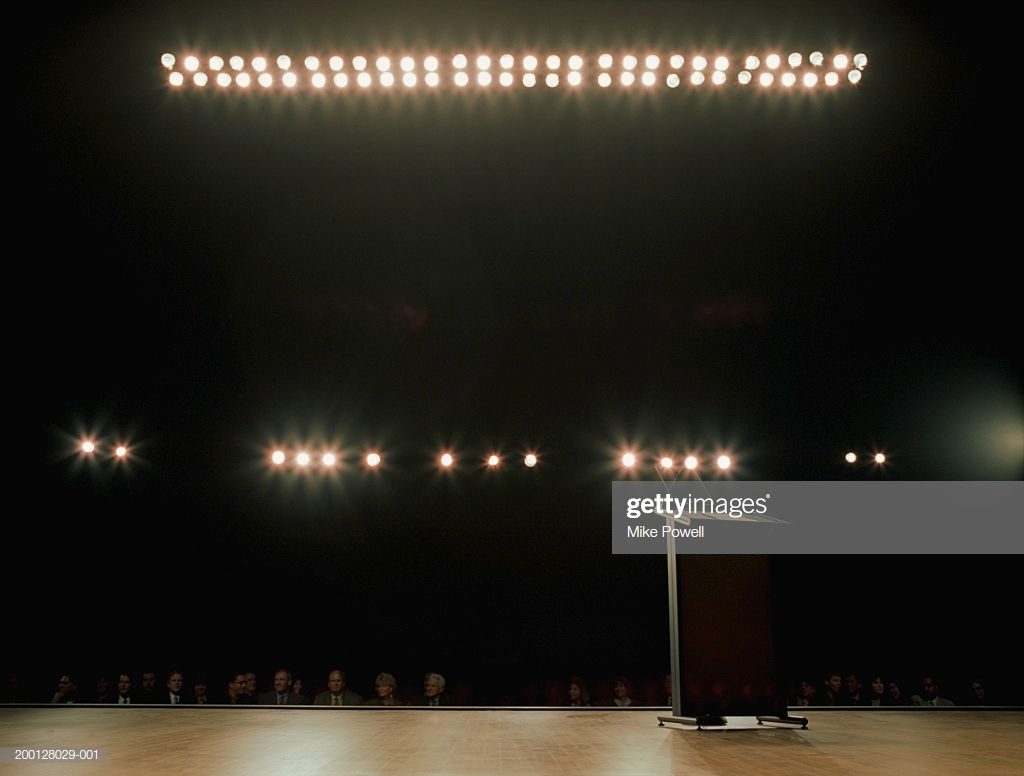 Empty Podium On Stage Audience In Background High Res Stock Photo