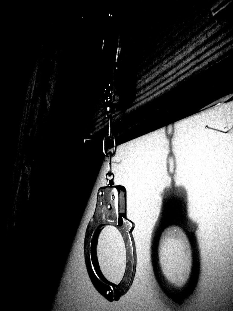 Hanging Handcuffs By Darkness In The Lens