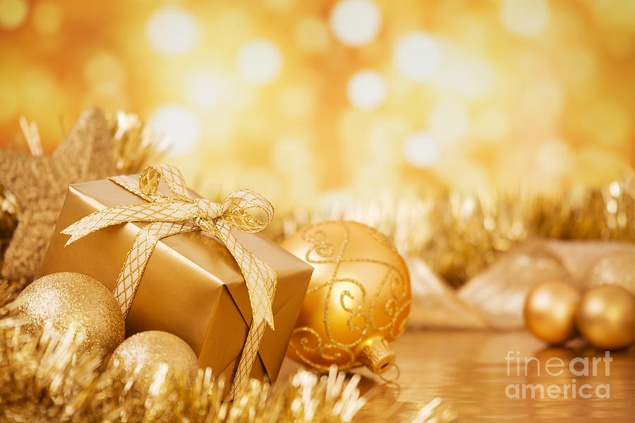 Christmas Scene With Gold Baubles And Gift On A Background