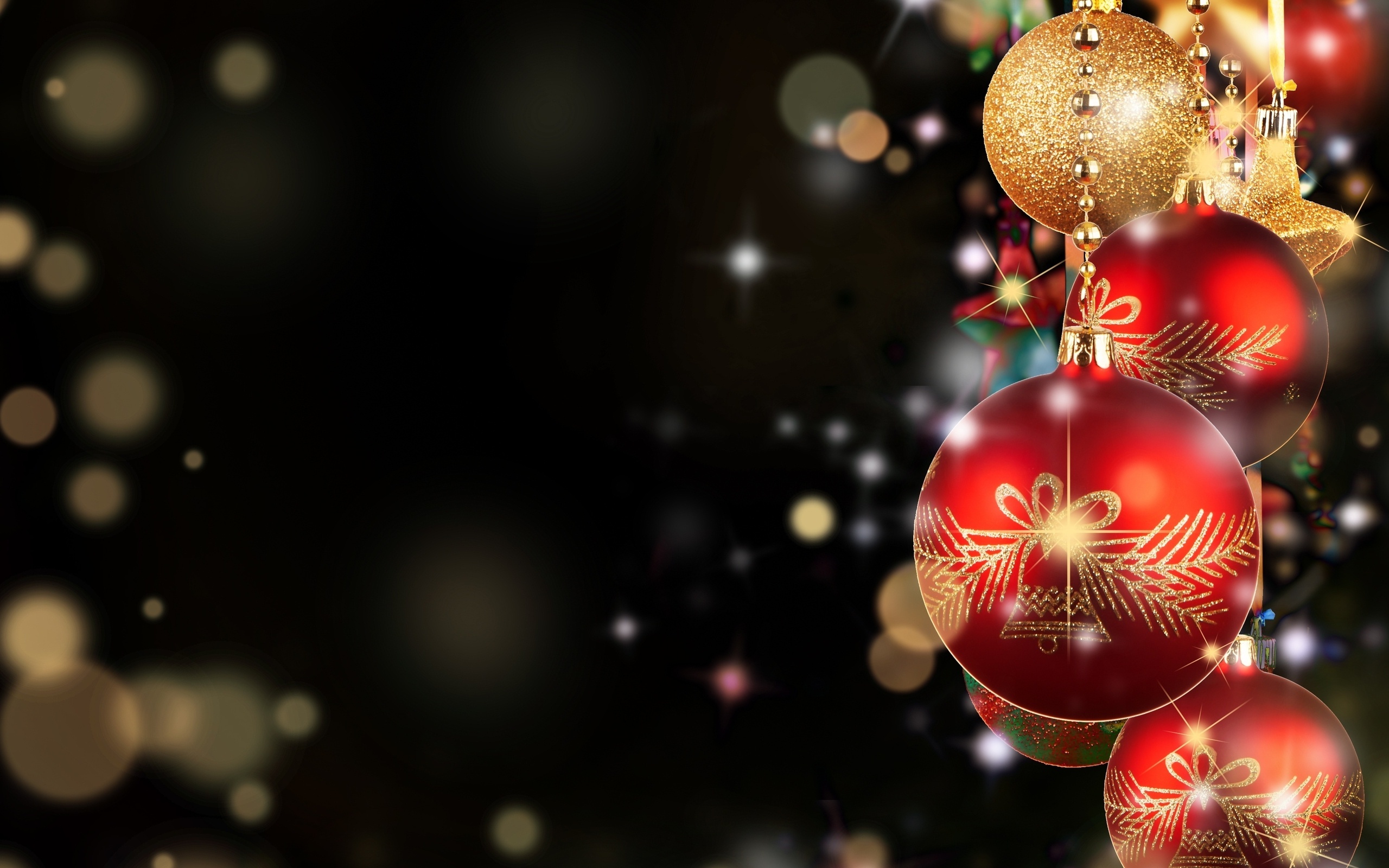 Red and gold Christmas ornaments on a dark background
