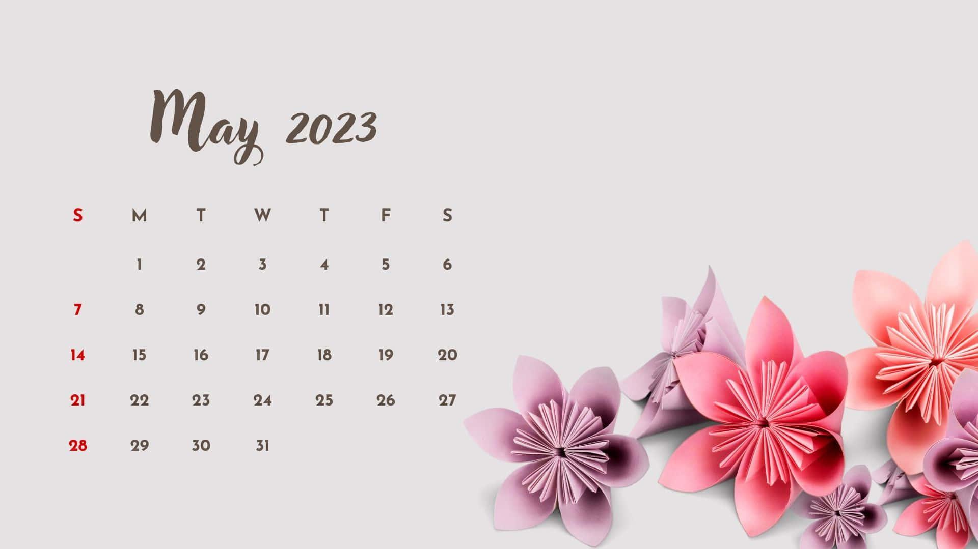 Download A Calendar With Pink Flowers On It Wallpaper