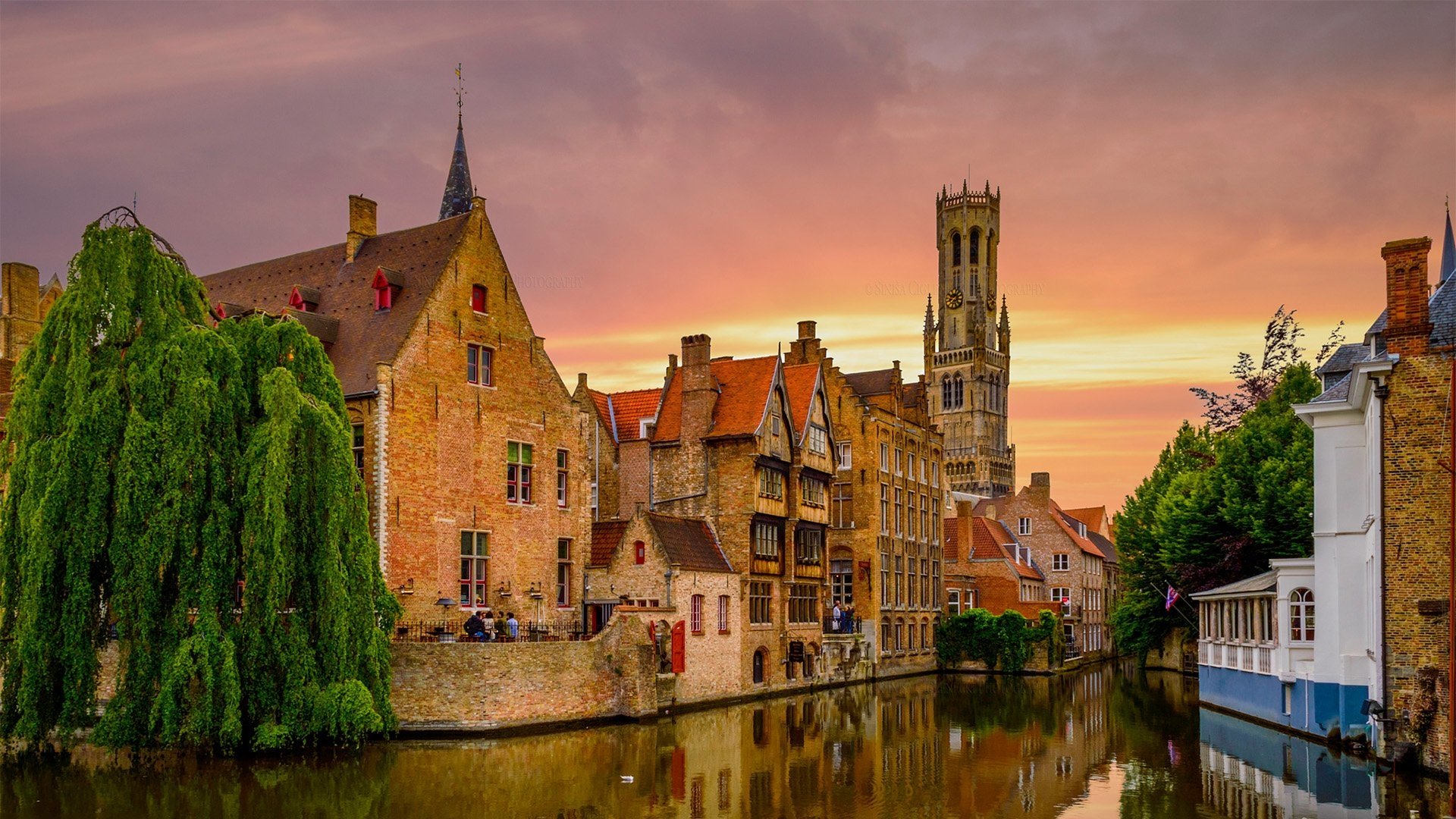 Buildings and Church along a Canal in Bruges Belgium HD Wallpaper 1920x1080