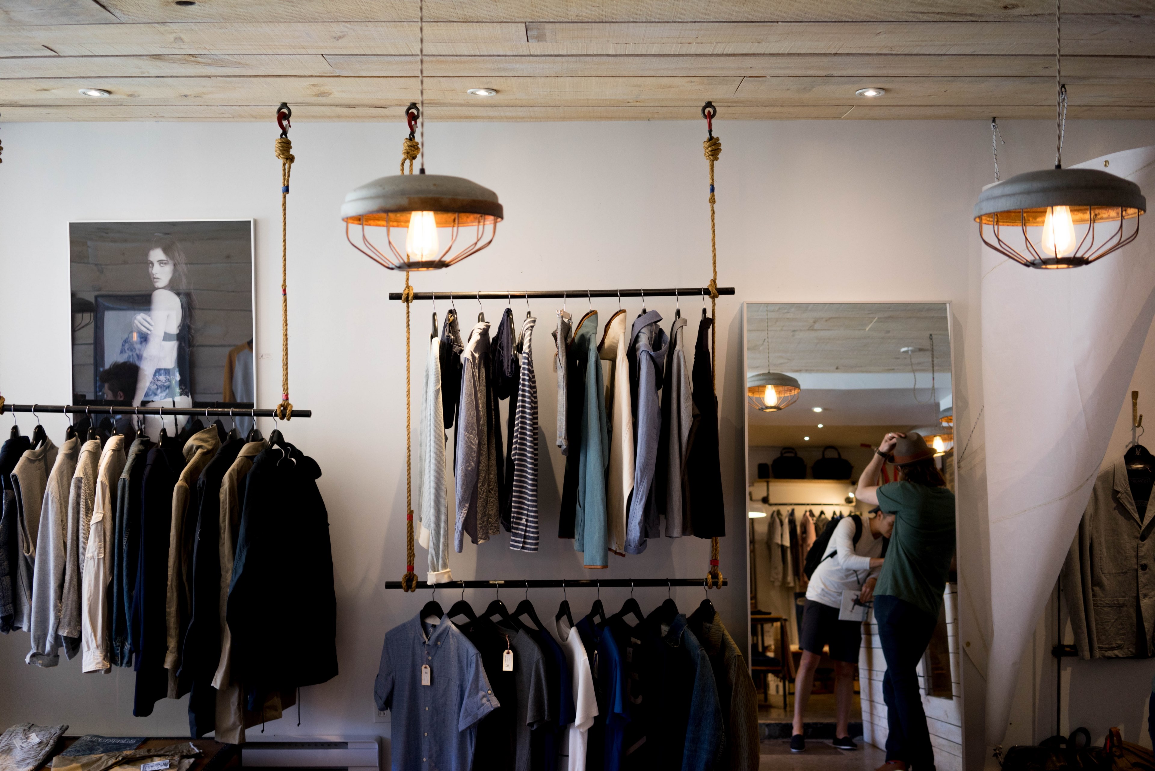 Racks With Mens Apparel On The Walls Of A Clothes Store Organization 4k HD Wallpaper