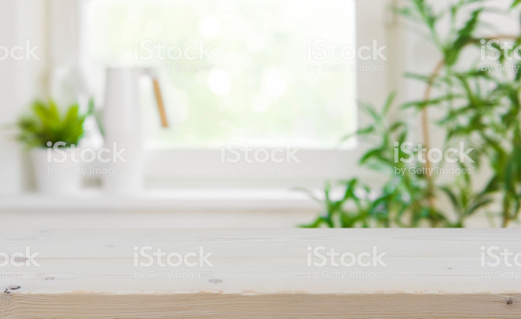 Wooden Tabletop With Copy Space Over Blurred Kitchen Window