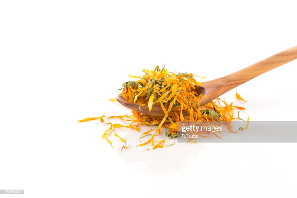 Calendula Flower Tea For Infusion In Wooden Spoon On White