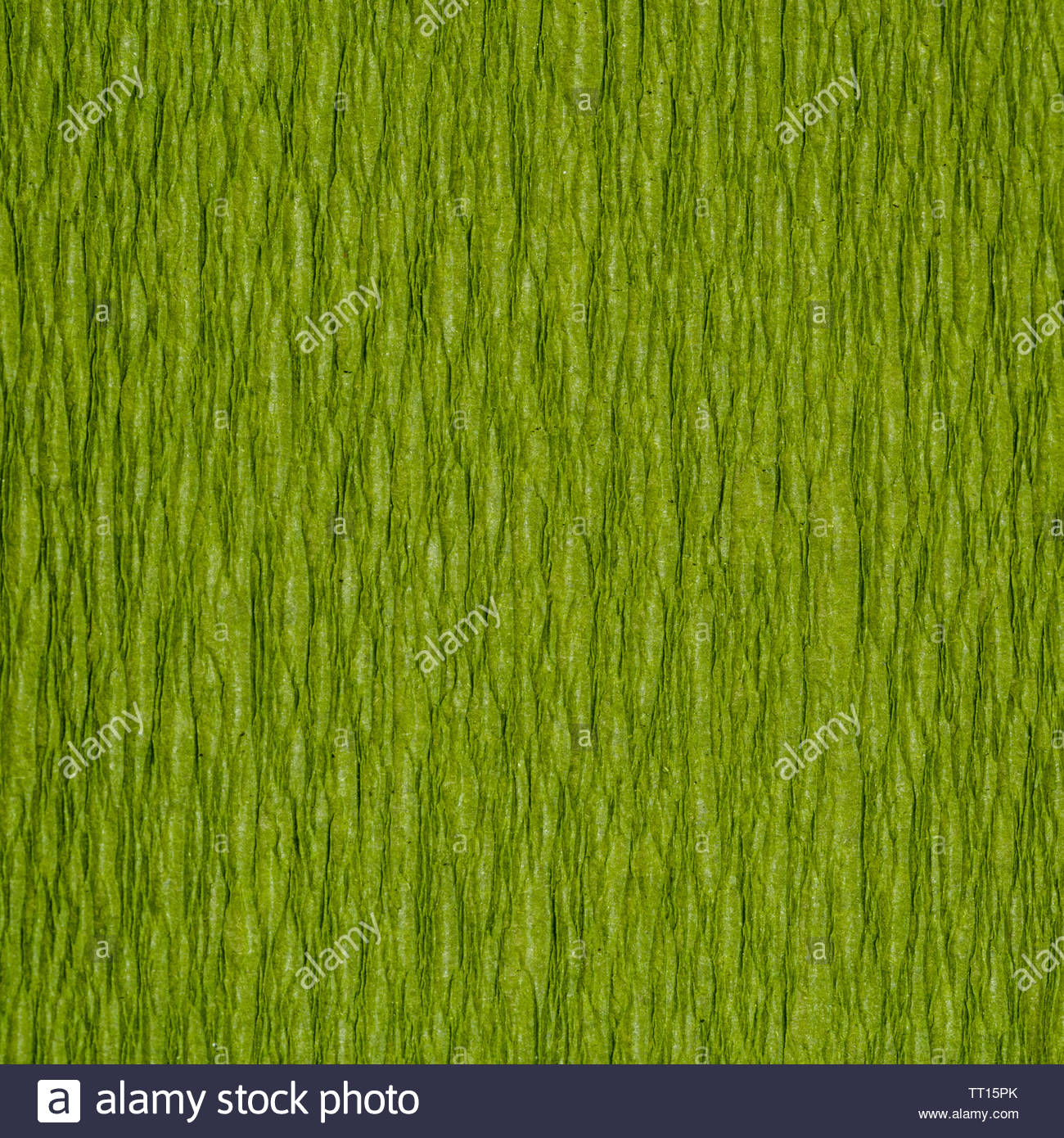Background From Green Chartreuse Color Corrugated Paper Close Up