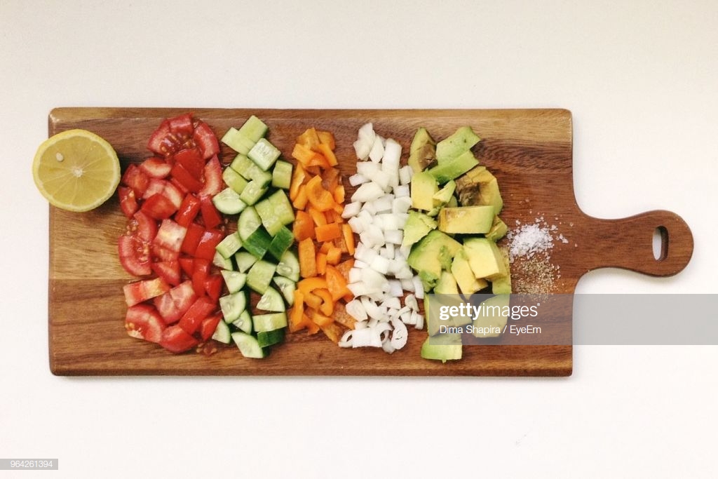 Directly Above Shot Of Chopped Vegetables On Cutting Board Over
