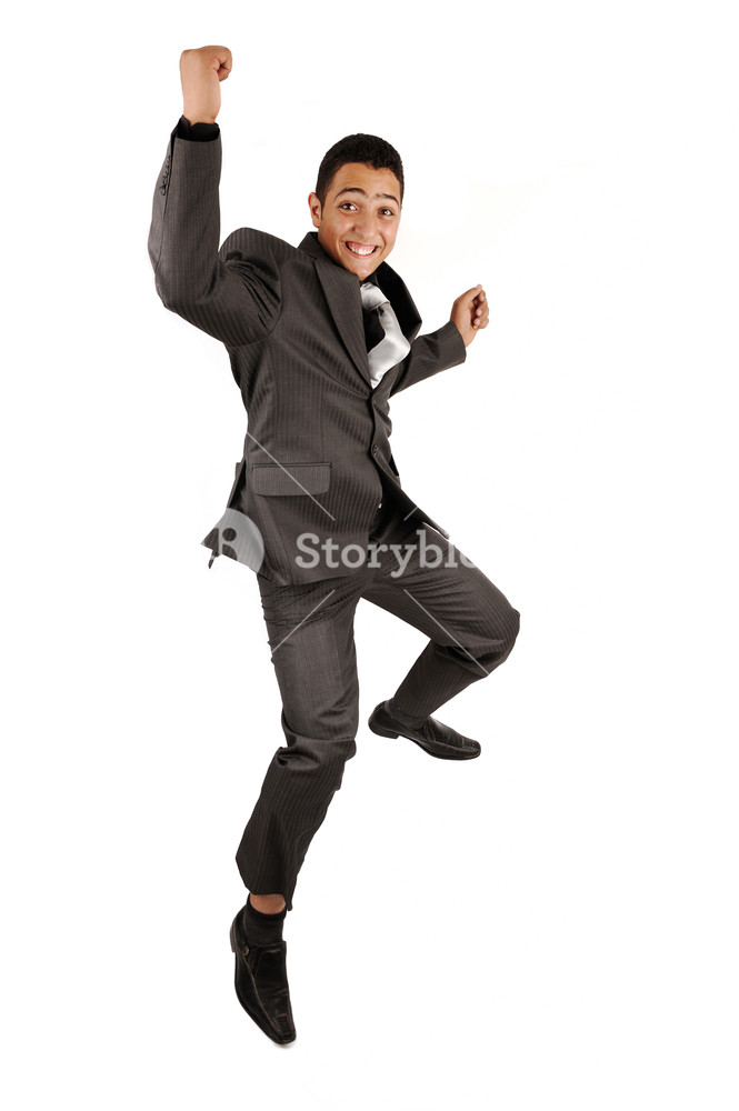 Portrait Of A Happy Businessman Jumping In Air Against Isolated