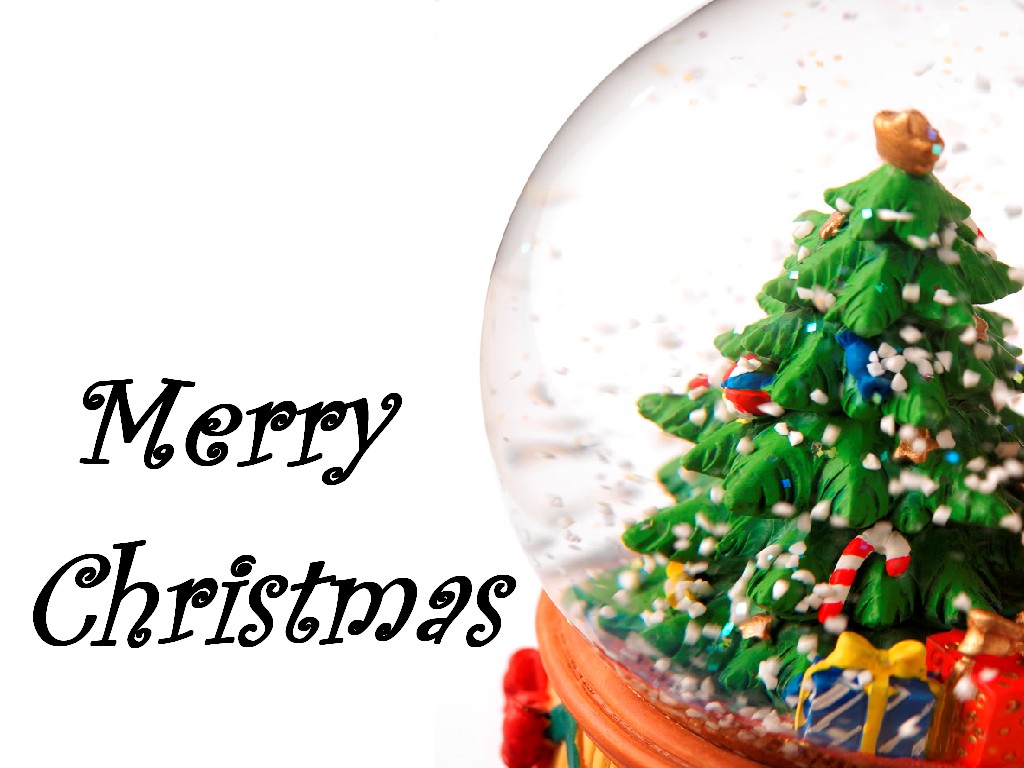 Merry Christmas Wallpaper With Decorated Tree In Snow Globe