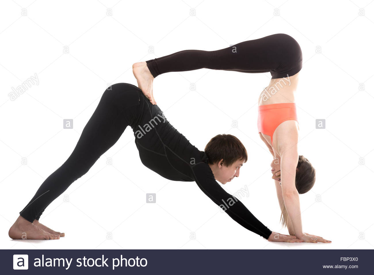 Sporty Couple On White Background Doing Acroyoga Yoga With