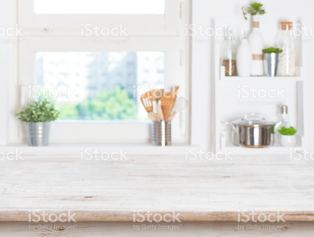 Empty Table On Blurred Background Of Kitchen Window And Shelves