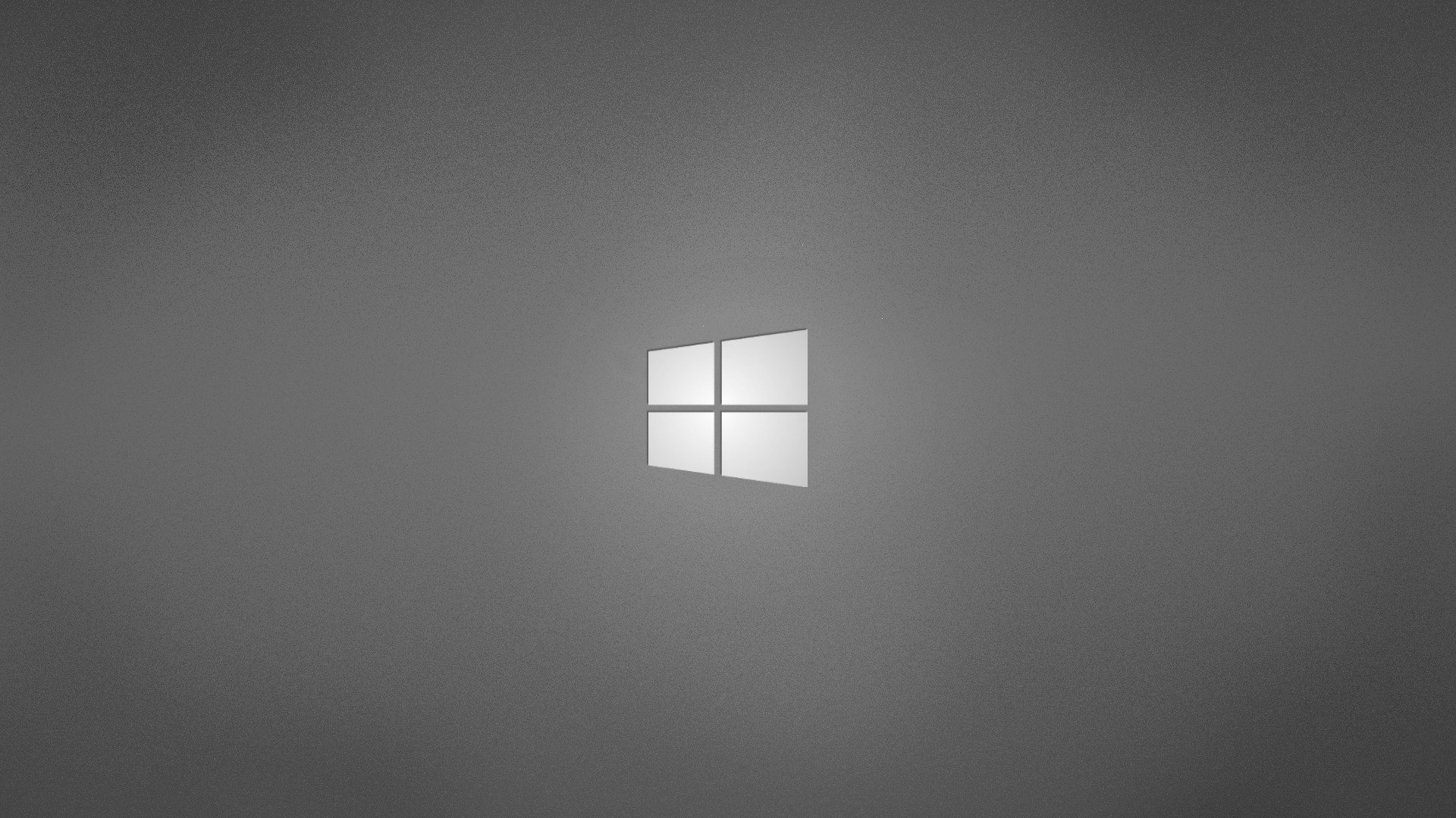 A minimalist gray wallpaper featuring a subtle Windows logo