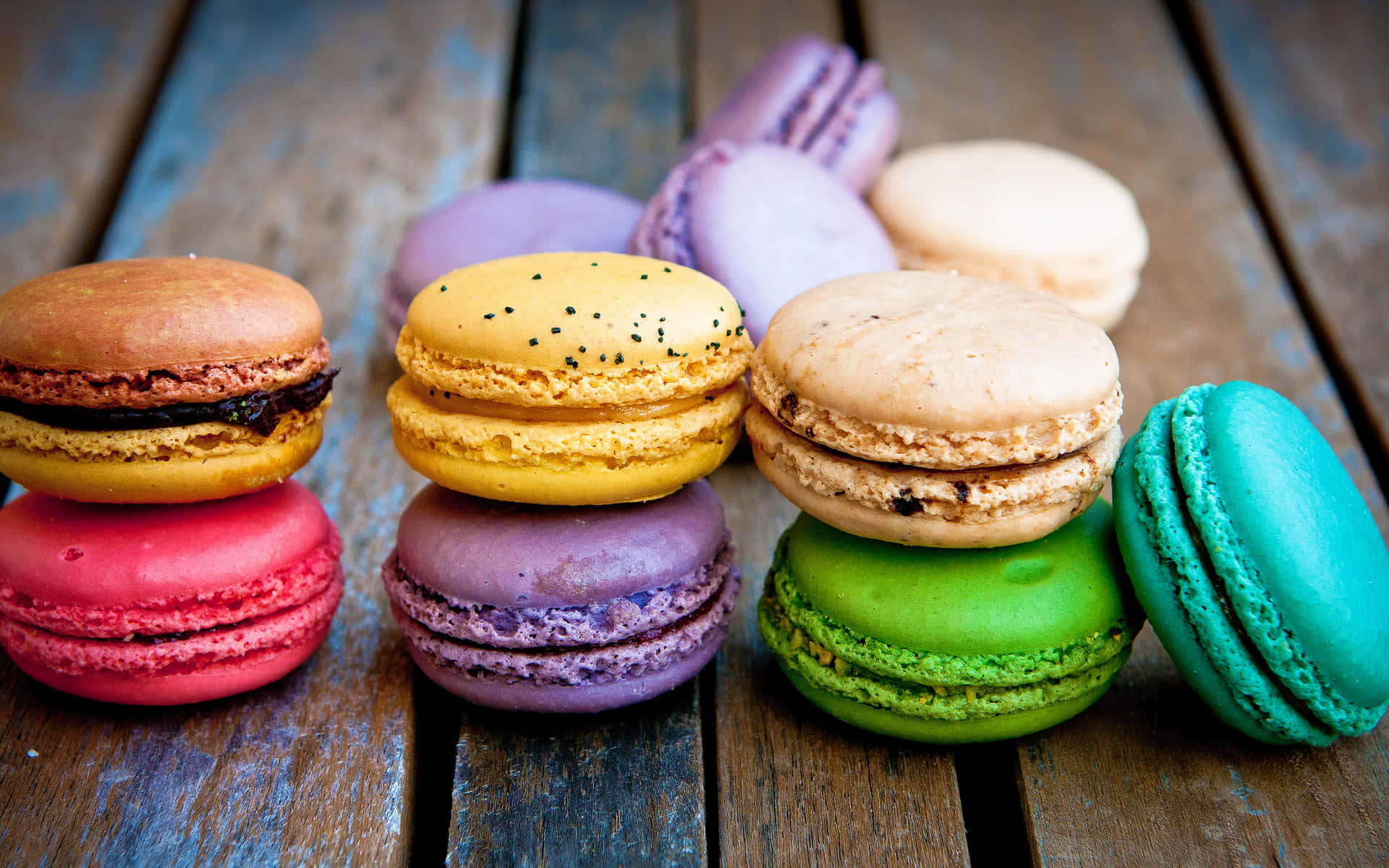 Macaron Stacked On Wooden Surface Rzvune7g9qmg1d7t Wallpaper