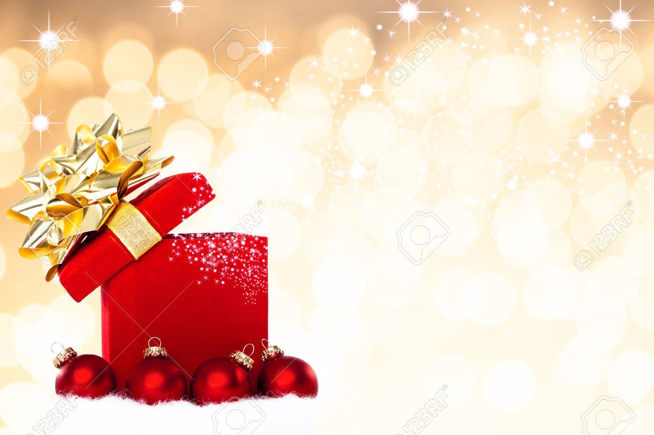 Magical Christmas Gift Background With Red Baubles Stock Photo